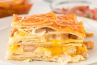 Layered Chicken Enchilada Casserole Recipe — Cheesy Mexican Bake