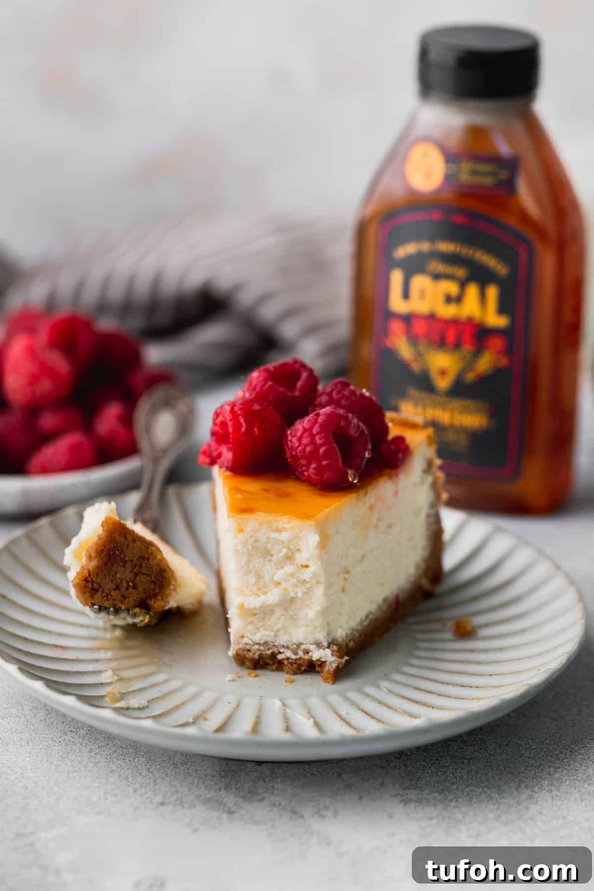 Decadent Honey Cheesecake Recipe with Silky Cream Filling 12 One slice of honey cheesecake on a plate.