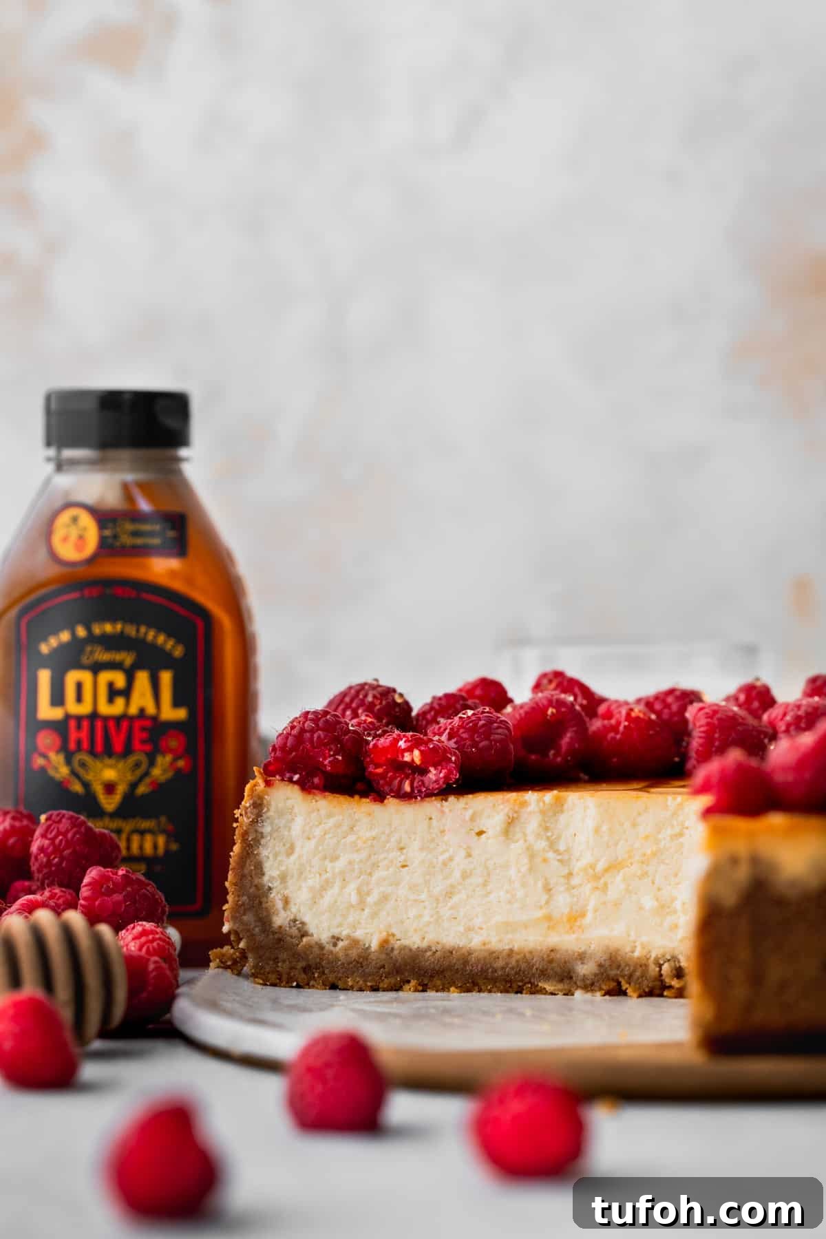 Decadent Honey Cheesecake Recipe with Silky Cream Filling 10 Side view of cheesecake.