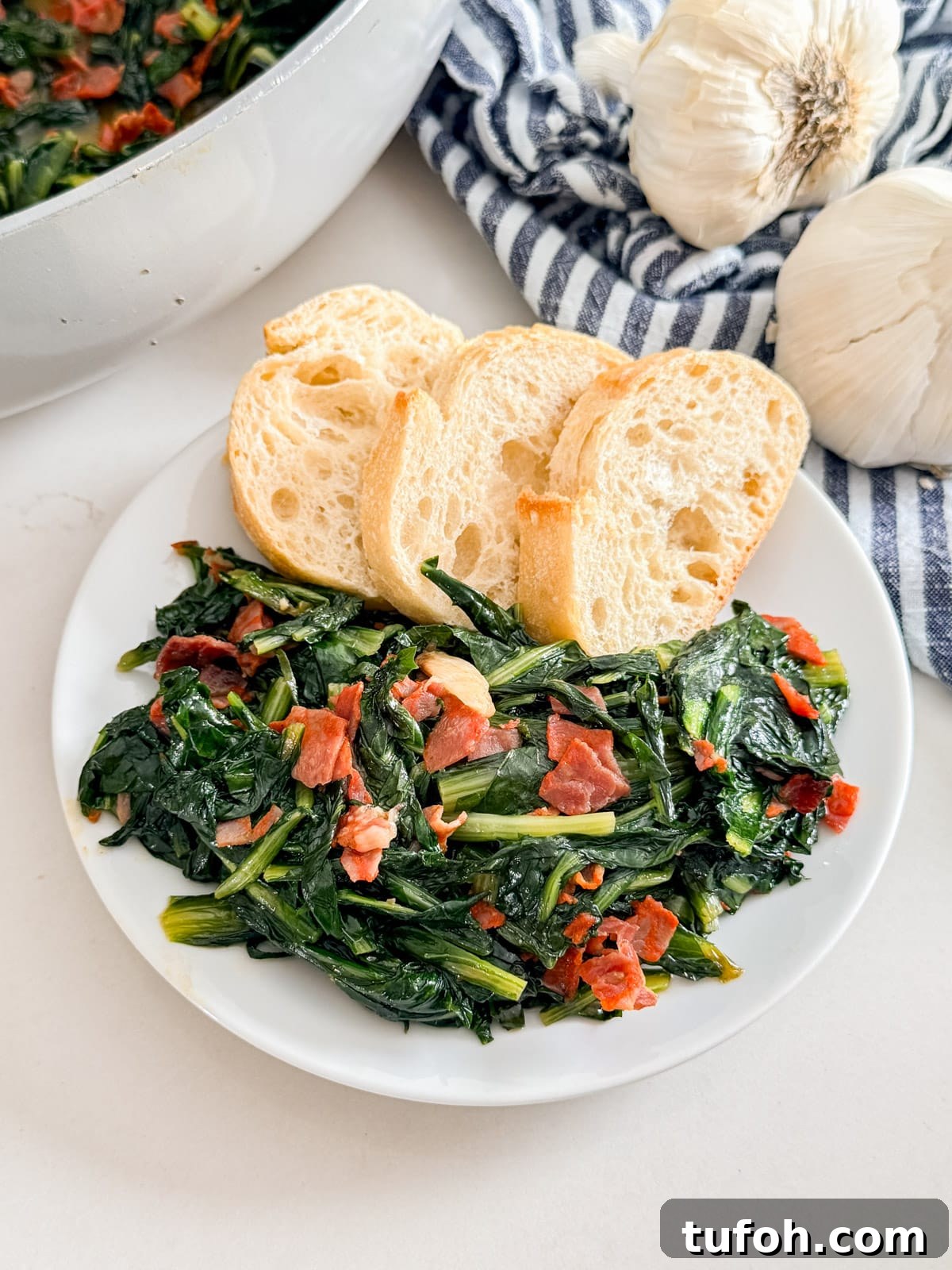 A plate of dandelion greens with bread.