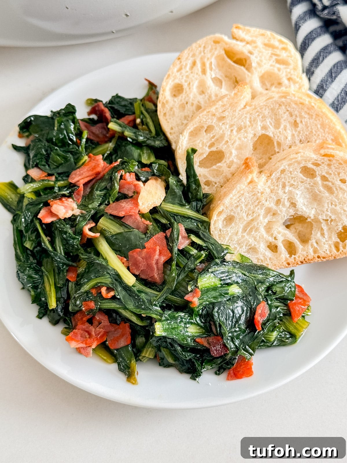 A plate of dandelion greens and bread.