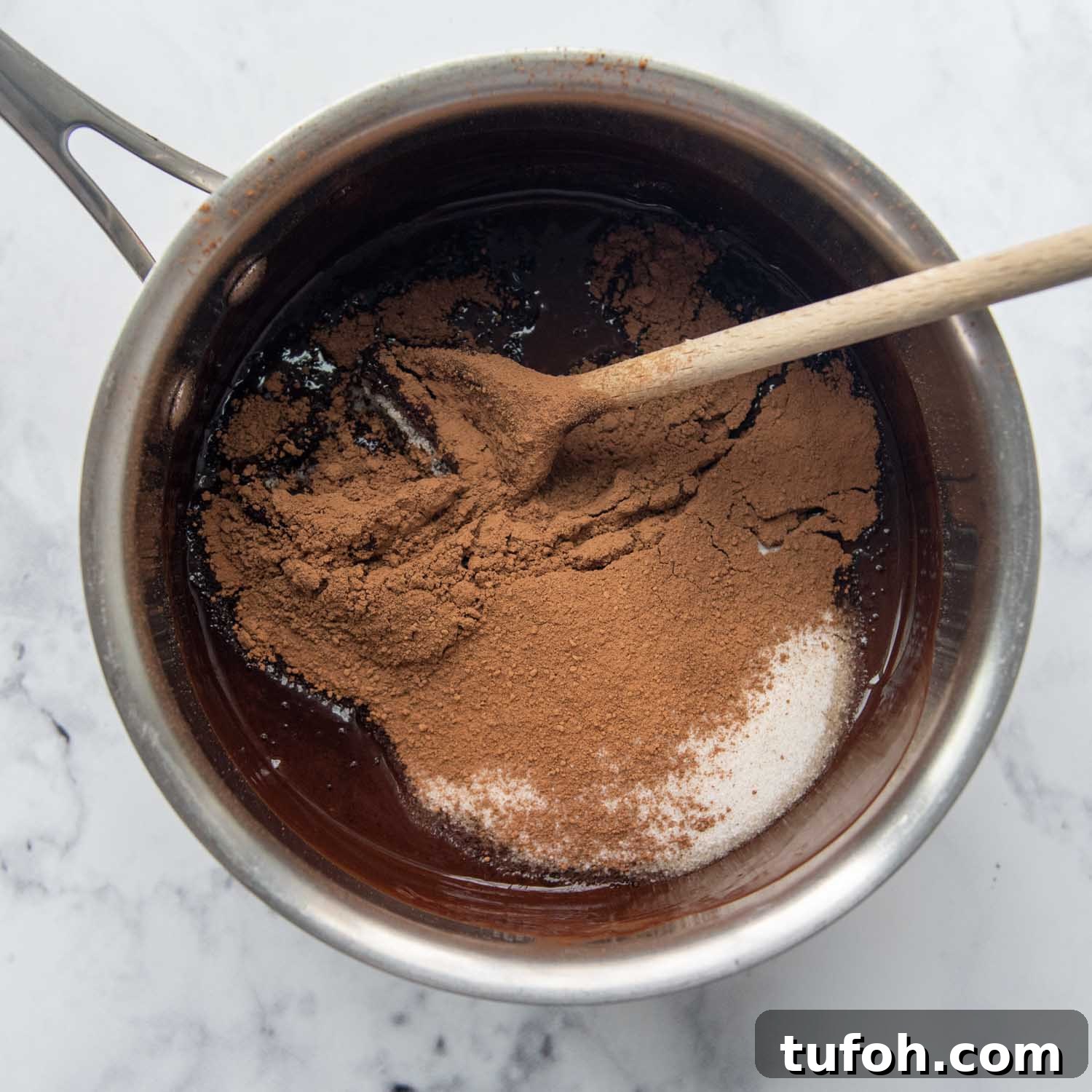 Ultra-Fudgy Almond Flour Chocolate Brownies 4 cocoa powder and sugar added in the pot.