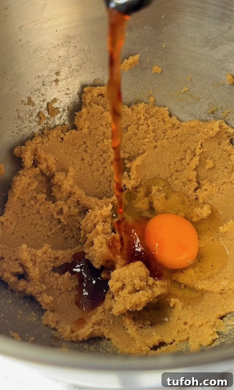 adding egg and vanilla to mini egg cookies dough.