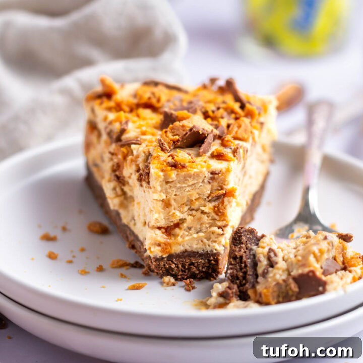 slice of butterfinger pie on a plate with a fork