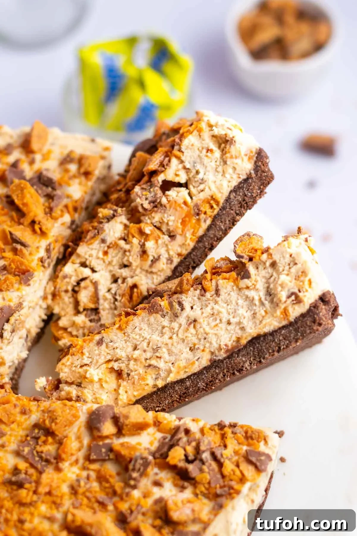 two slices of butterfinger pie on their side, showing the middle texture