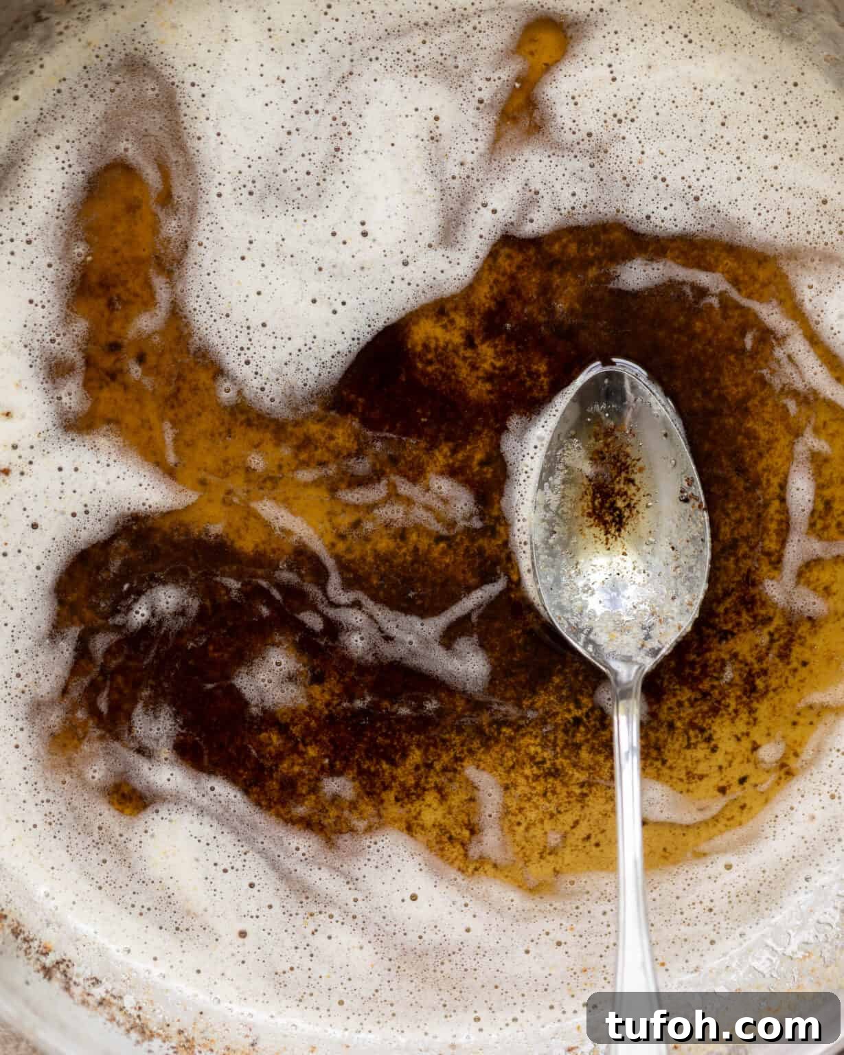 Master Brown Butter: Step-by-Step Guide for Nutty, Aromatic Finish 7 brown butter melted in a pan with a spoon