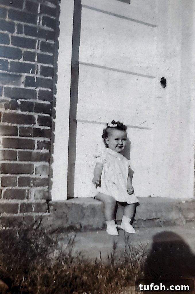 Preserve Family Photos and Protect Your Family History 12 Little girl Doris Carr sitting on house steps