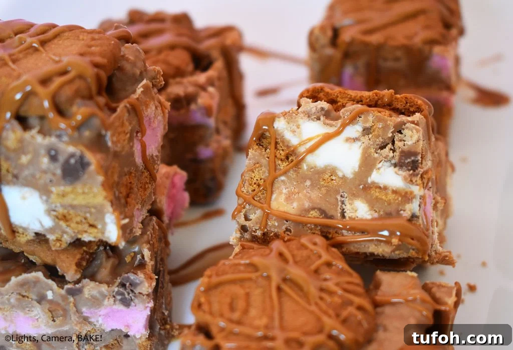 Biscoff Rocky Road Recipe: No-Bake Biscoff Chocolate Squares 4 Biscoff Rocky Road on a white plate.