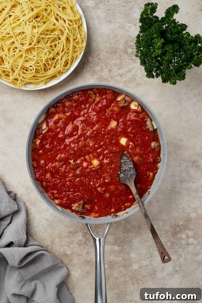 Ultimate Cheesy Baked Spaghetti Casserole Recipe 7 Meat sauce in a skillet.