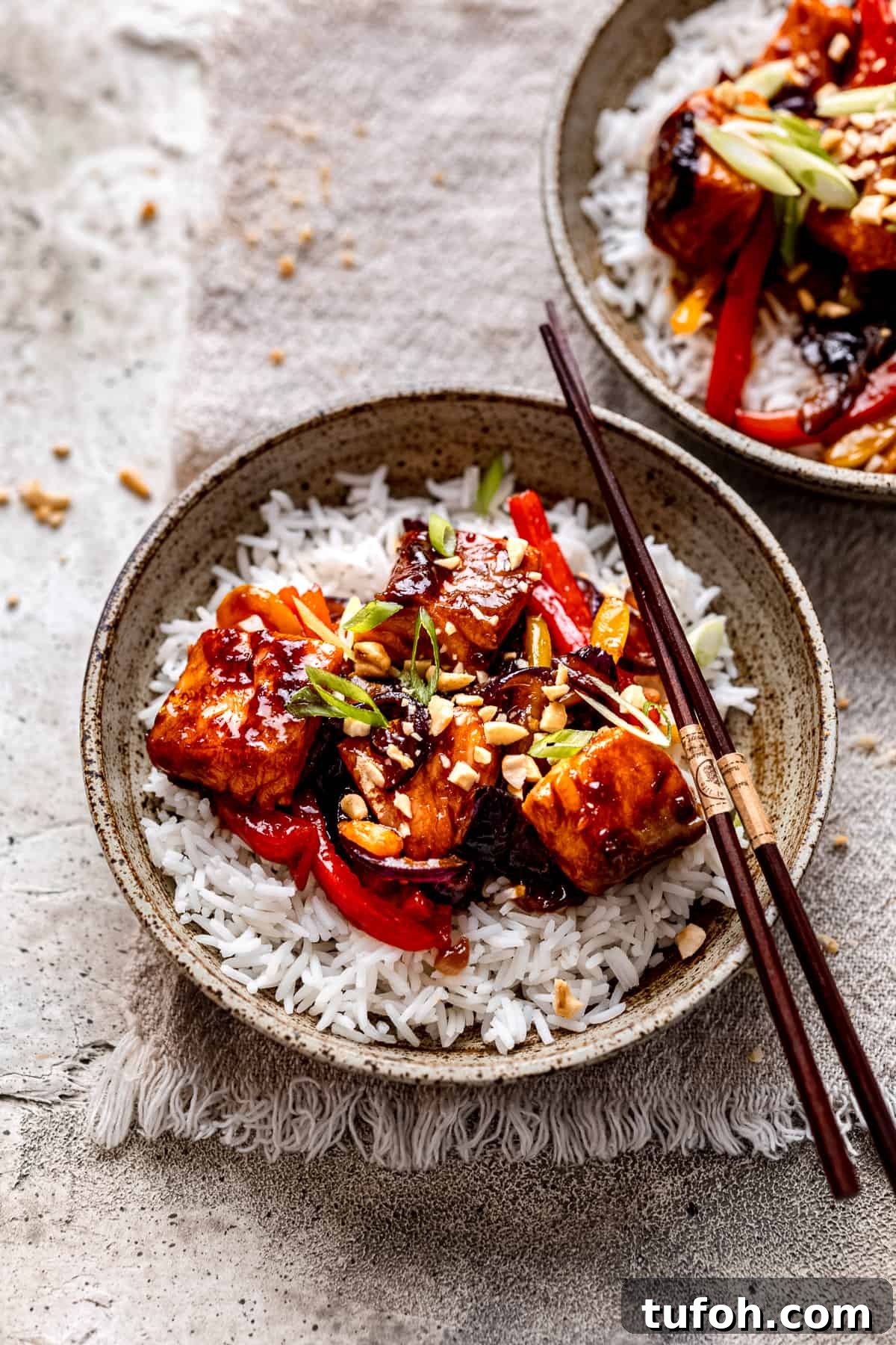 30-Minute Teriyaki Salmon Stir-Fry with Veggies 2 Salmon stir fry in a green bowl.