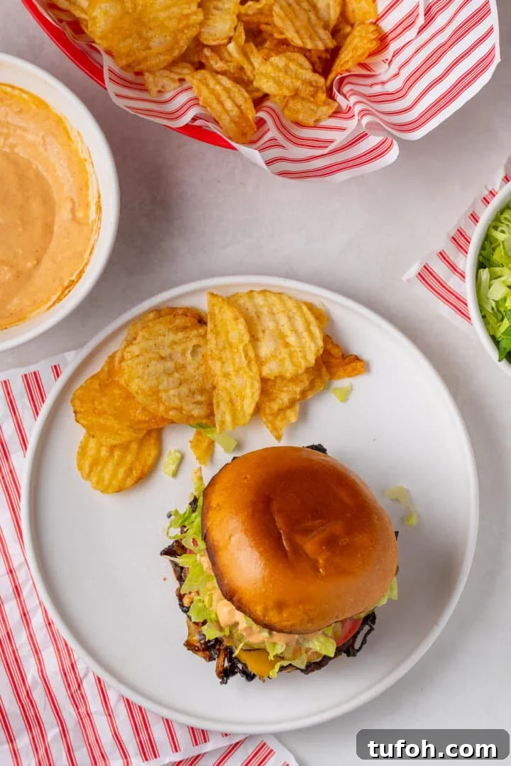 Caramelized Onion Smash Burger — Next-Level Flavor 18 overhead view of a caramelized onion burger and pile of potato chips
