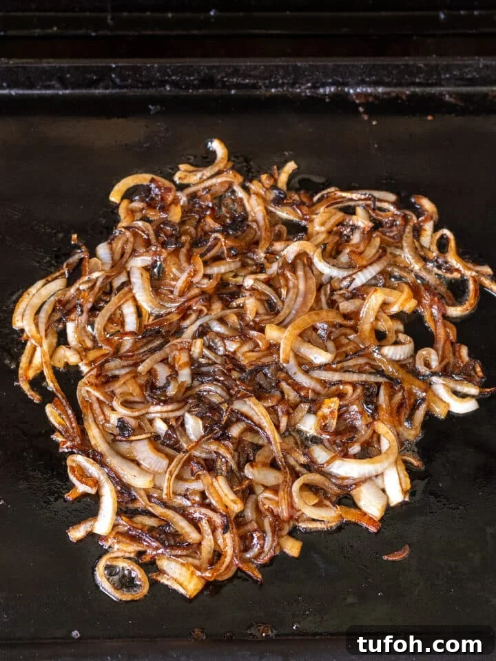 Caramelized Onion Smash Burger — Next-Level Flavor 9 golden brown caramelized onions on grill