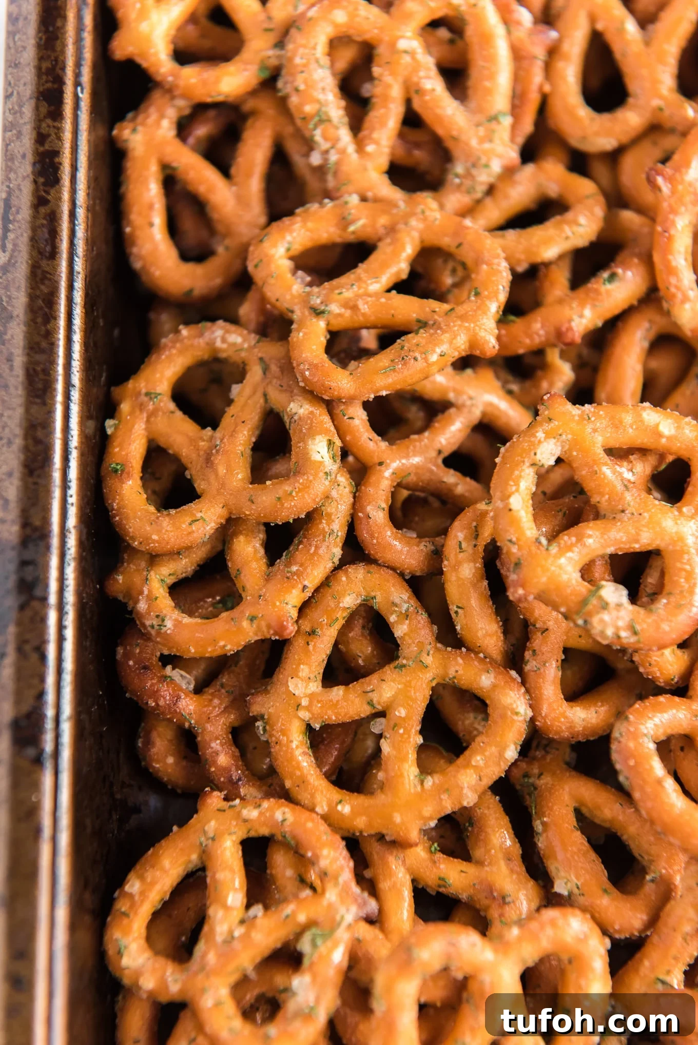 Crunchy Ranch Pretzel Bites: Savory Snack Recipe 6 Close up shot of ranch pretzels on a baking sheet.