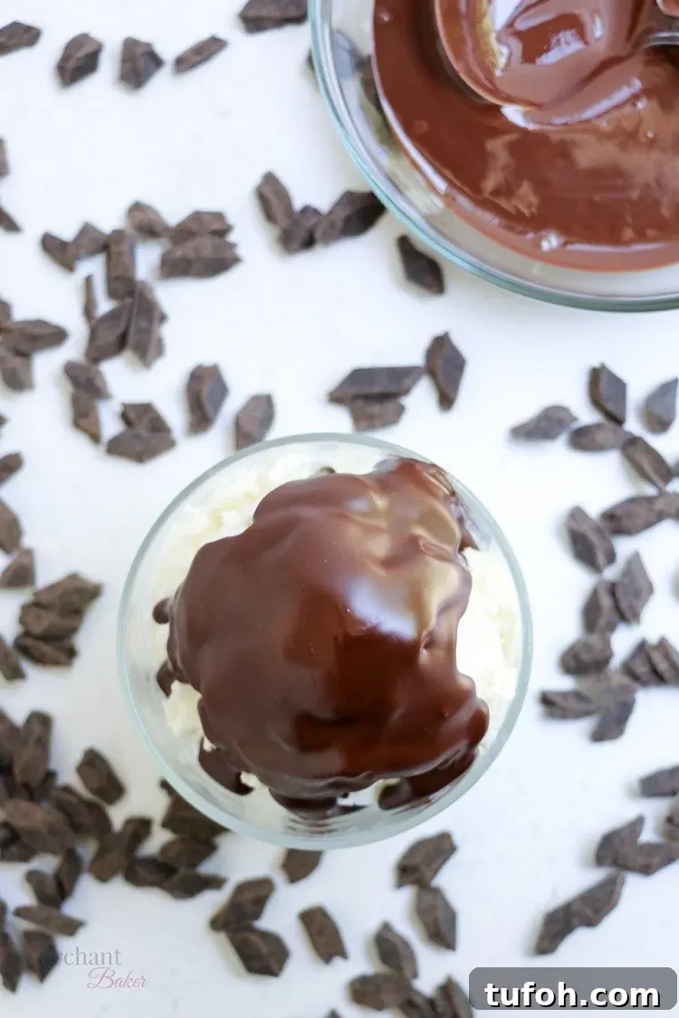 Chocolate Shell Ice Cream Topping: Crunchy Hard Chocolate Coating 6 Top view of Chocolate Hardshell Ice Cream Topping hardened on a bowl of vanilla ice cream from themerchantbaker.com