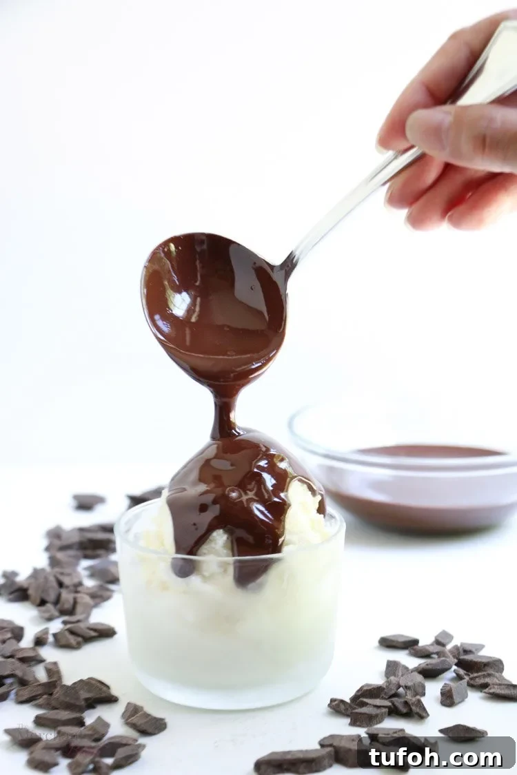 Chocolate Shell Ice Cream Topping: Crunchy Hard Chocolate Coating 3 Chocolate Hardshell Ice Cream Topping being poured onto ice cream from themerchantbaker.com