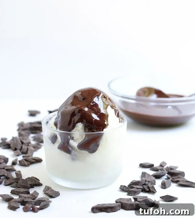 Chocolate Shell Ice Cream Topping: Crunchy Hard Chocolate Coating 4 Chocolate Hardshell Ice Cream Topping waiting to harden on a bowl of vanilla ice cream from themerchantbaker.com