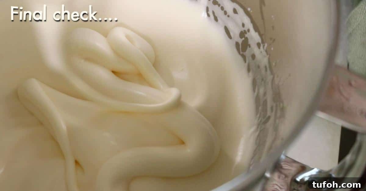 whipped shiny egg and sugar in a bowl