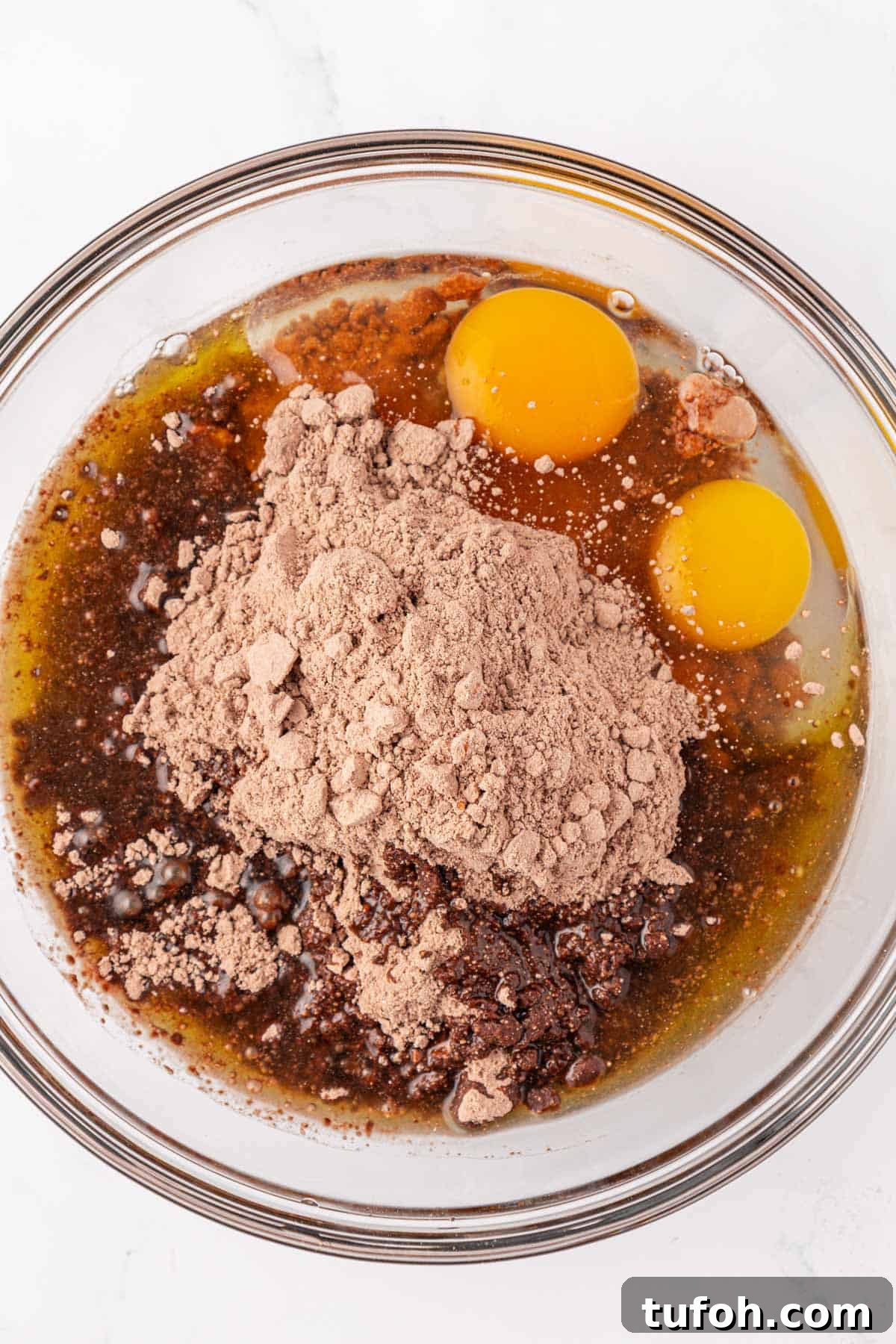 eggs, oil, and cake mix in a mixing bowl