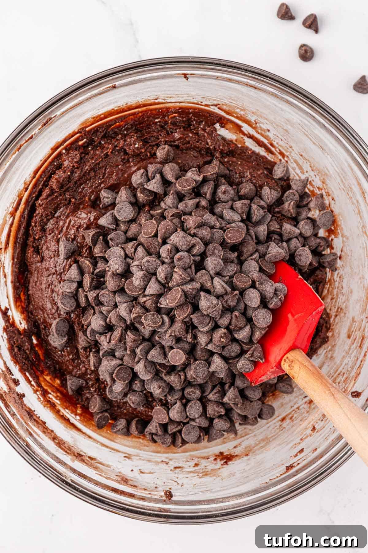 adding the chocolate chips to the batter