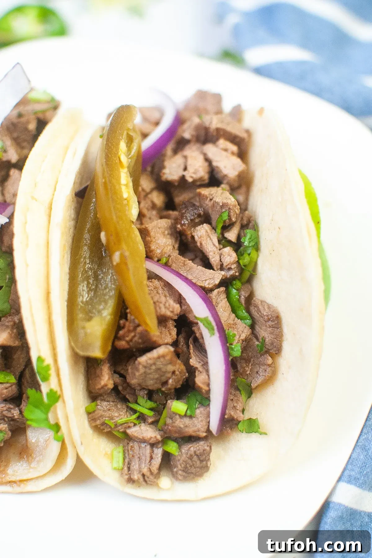 Crispy Air Fryer Street Tacos Recipe for Quick Weeknight Meals 7 Close up looking at one image of a street taco.