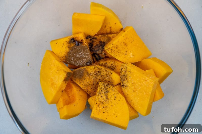 Adding spices to the butternut squash