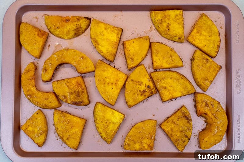 Removing the butternut squash from the oven