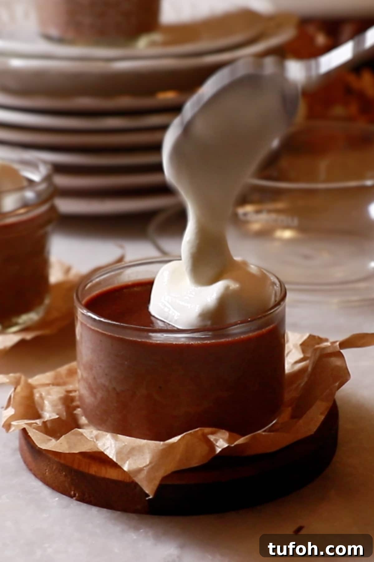 Decadent Baked Chocolate Pudding Recipe for Chocolate Lovers 13 topping whipped cream on homemade chocolate pudding in a cup