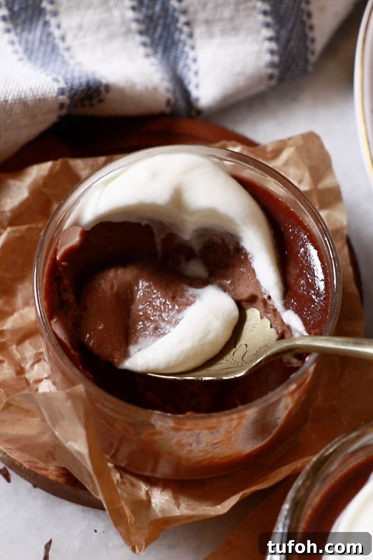 Decadent Baked Chocolate Pudding Recipe for Chocolate Lovers 14 a homemade chocolate pudding in glass cup topped with whipped cream
