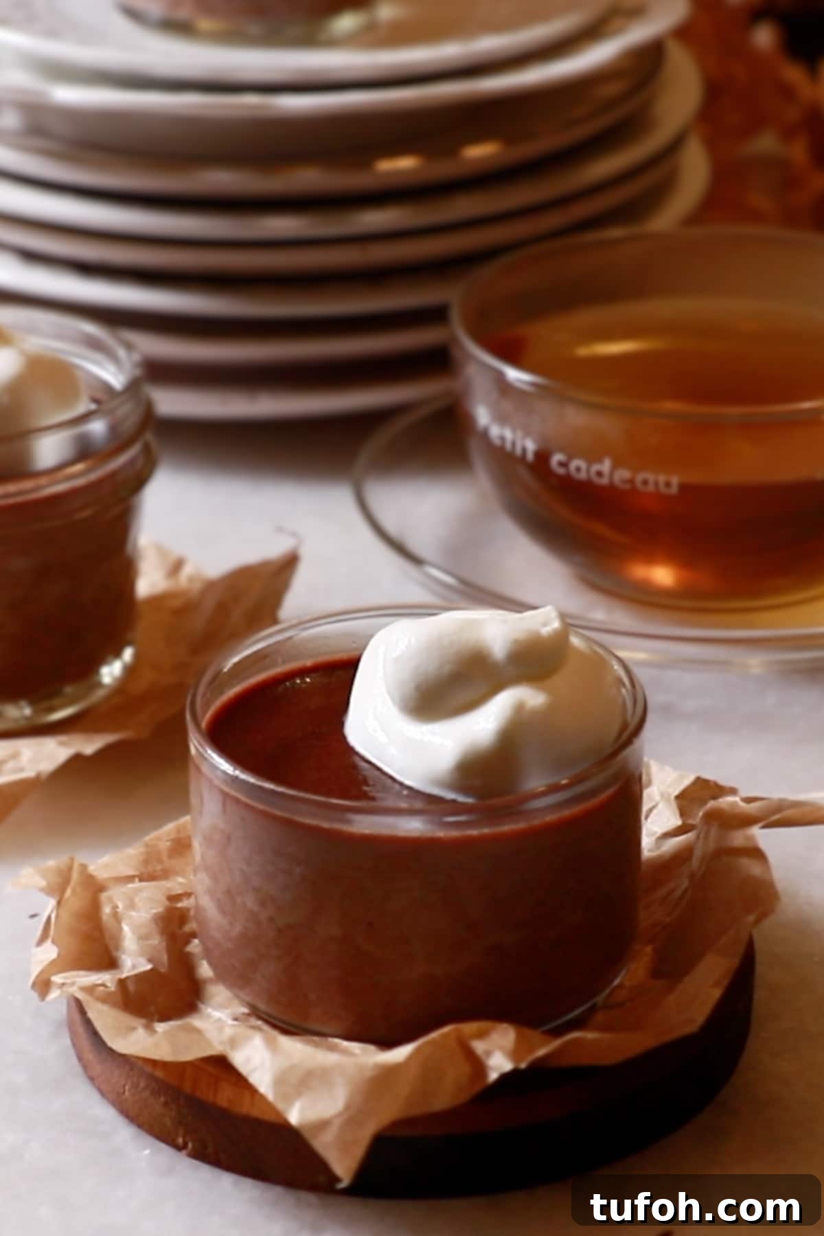 Decadent Baked Chocolate Pudding Recipe for Chocolate Lovers 4 homemade chocolate puddings in glass cups topped with whipped cream