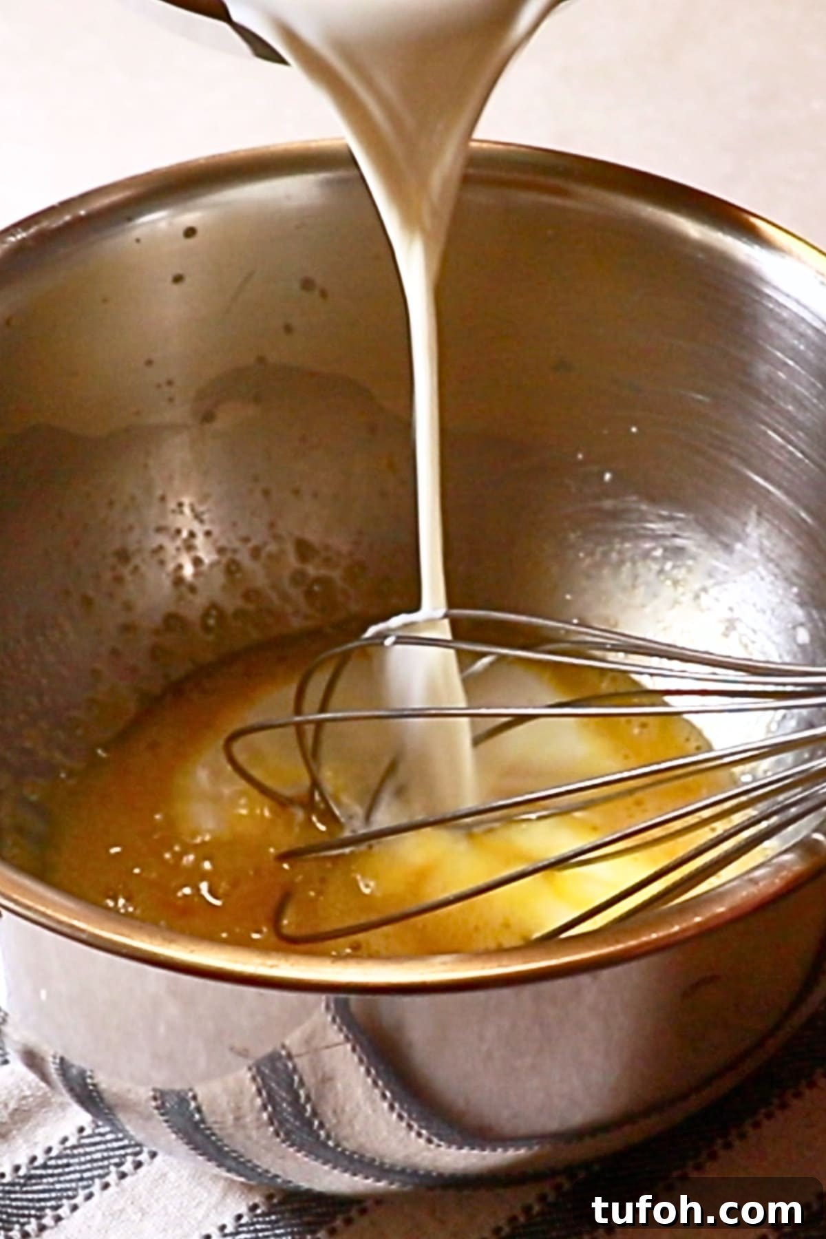 Decadent Baked Chocolate Pudding Recipe for Chocolate Lovers 9 pouring the hot liquids into the egg mixture