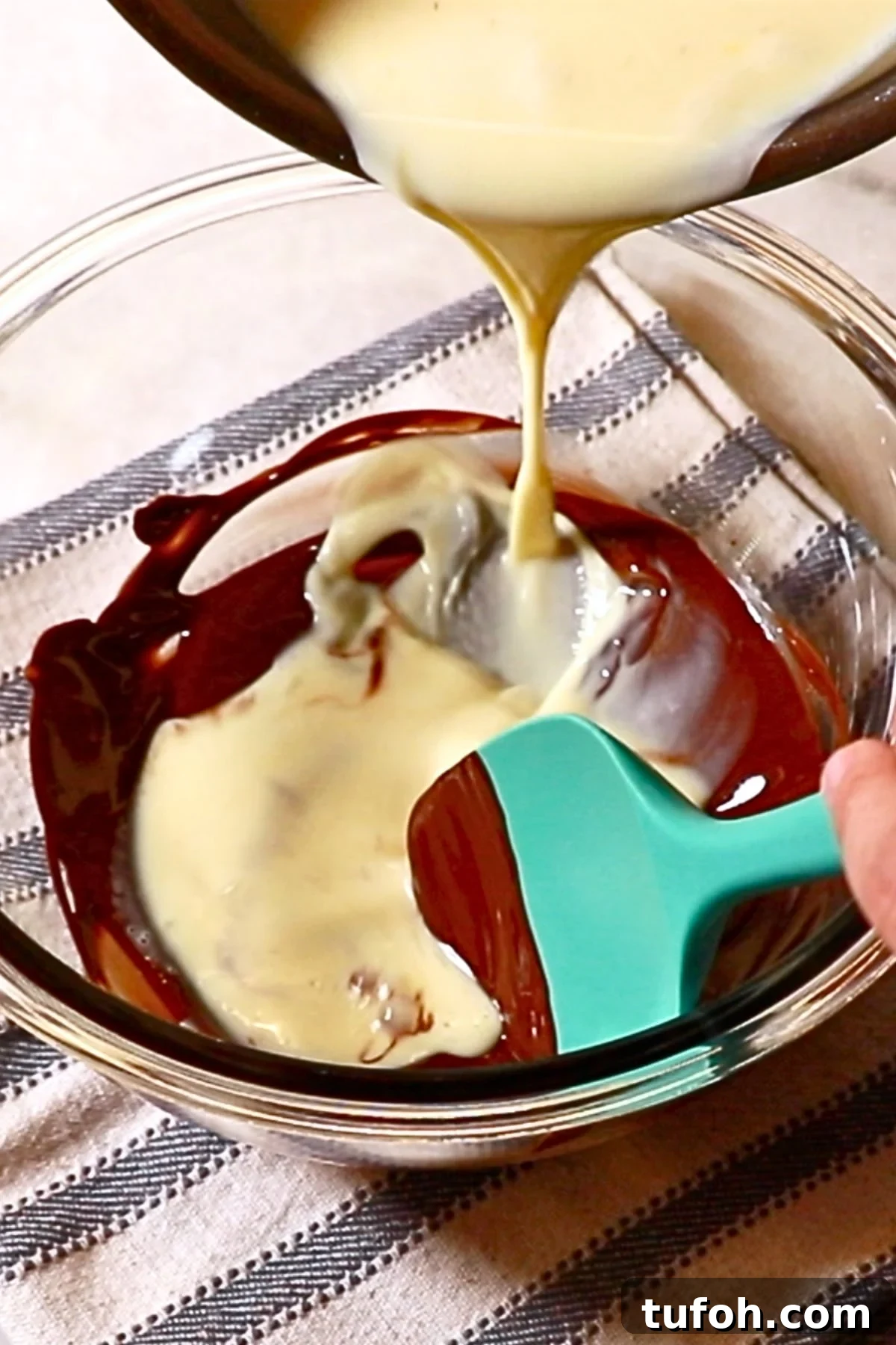 Decadent Baked Chocolate Pudding Recipe for Chocolate Lovers 10 pouring the liquid into the melted chocolate in a bowl