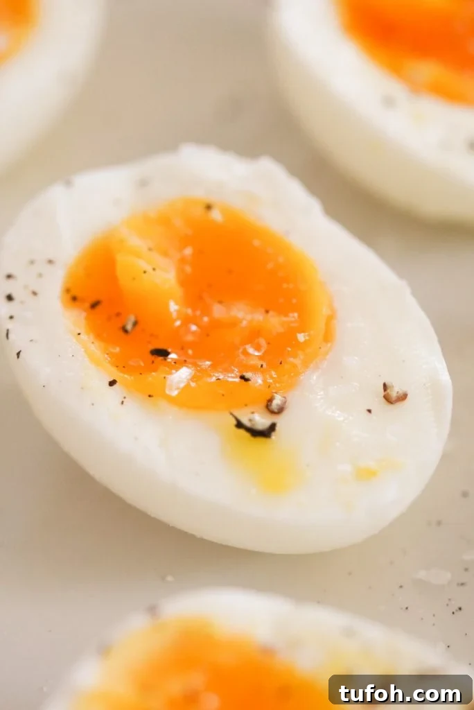 Perfect Jammy Eggs: Soft-Boiled Recipe for Runny Yolks 8 half of a jammy egg with salt and pepper