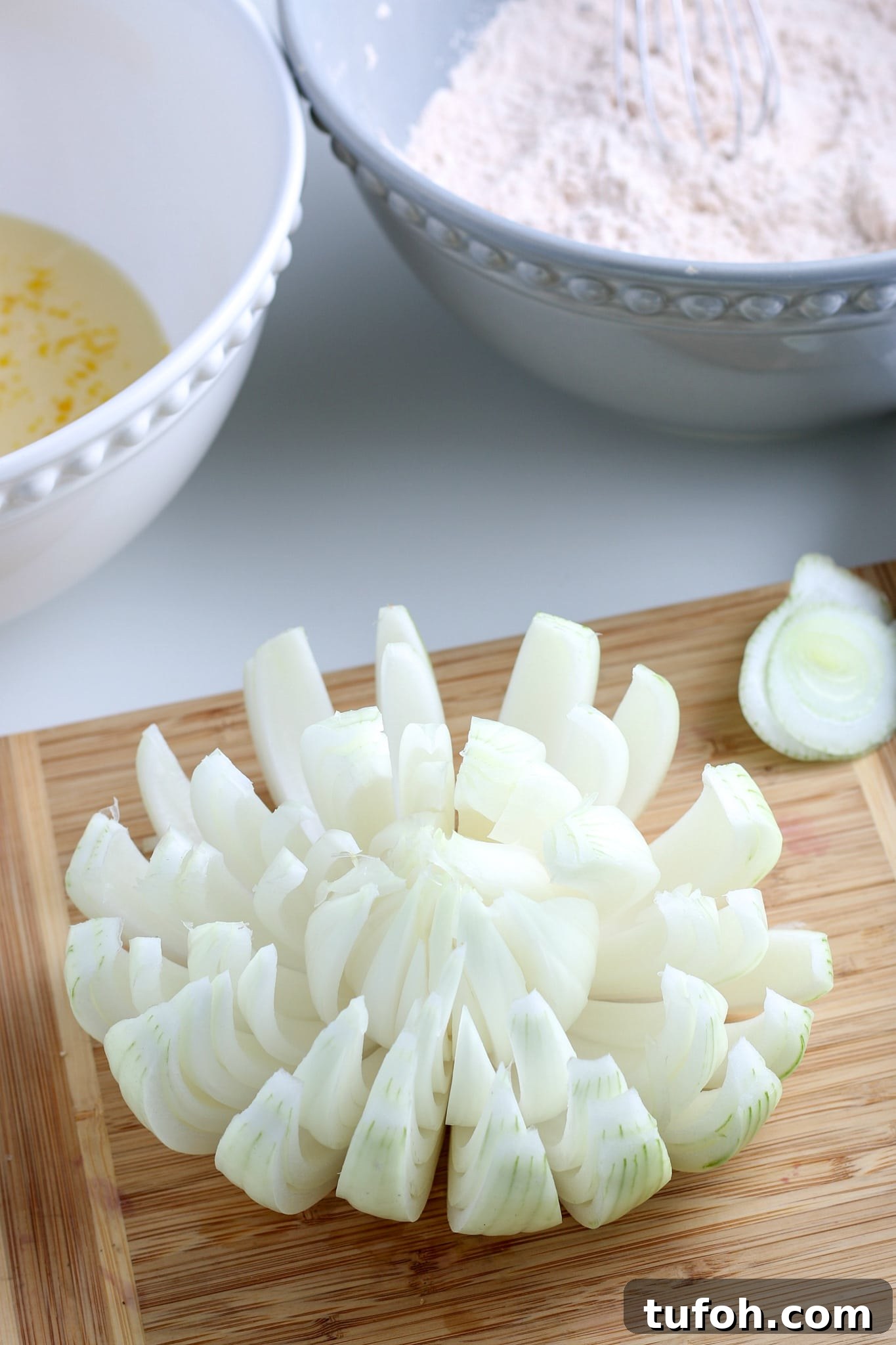 Crispy Air Fryer Bloomin' Onion Recipe for Game Day 7 the onion cut into a bloom.