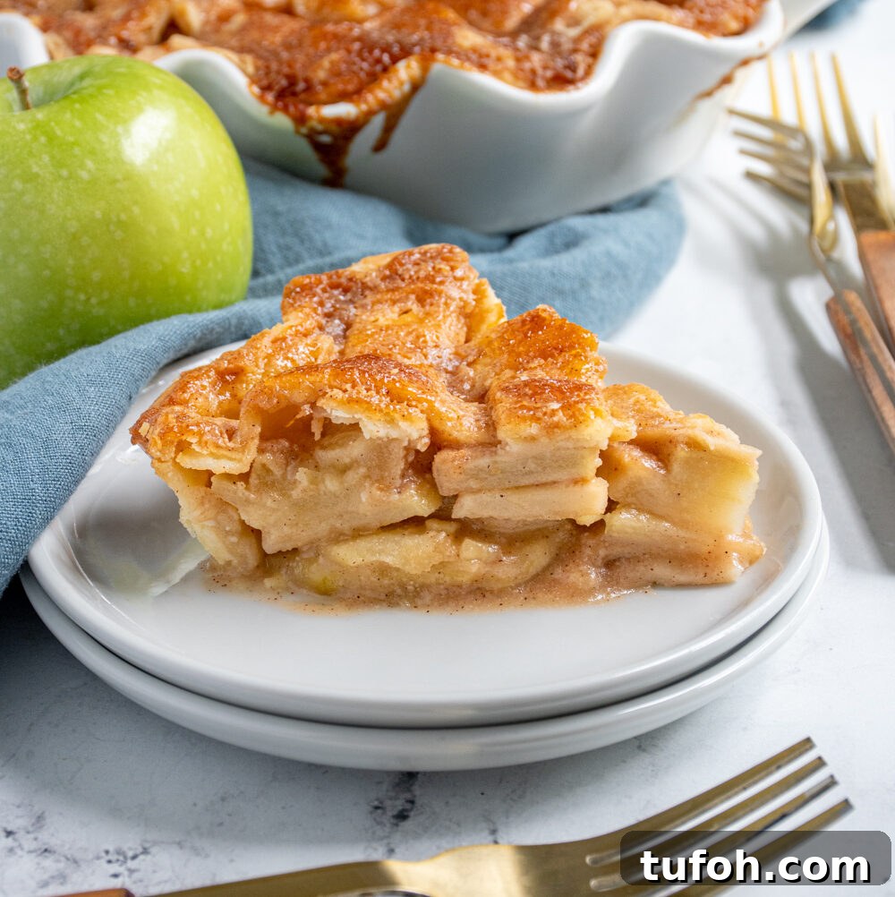 Slow-Cooker Beef Stew with Tender Chunks and Veggies 10 A slice of homemade apple pie on a plate showing of the apple inside and the lattice top.