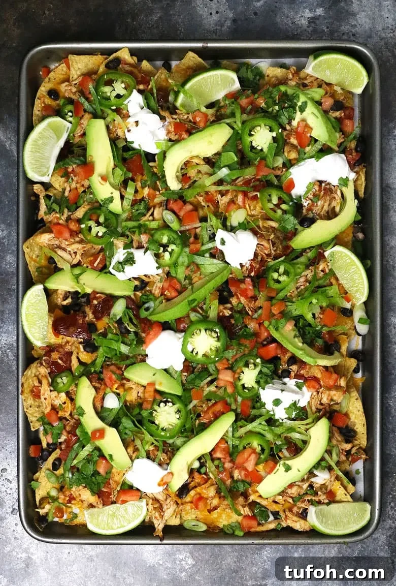 Sheet Pan Chicken Nachos with Loaded Toppings 4 overhead picture of loaded sheet pan chicken nachos