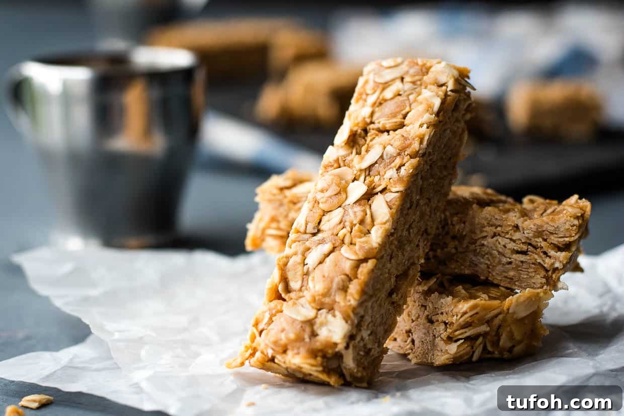 21 Kid-Friendly Treats to Make Together (Simple Recipes) 12 A stack of peanut butter oatmeal bars on a piece of paper.