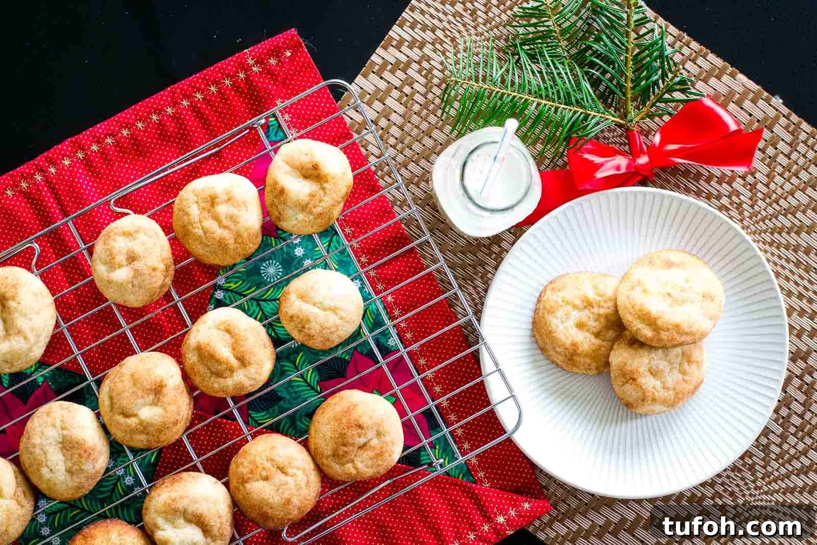 21 Kid-Friendly Treats to Make Together (Simple Recipes) 17 Overhead shot of a plate with three cookies next to a wire rack filled with cooling cookies.