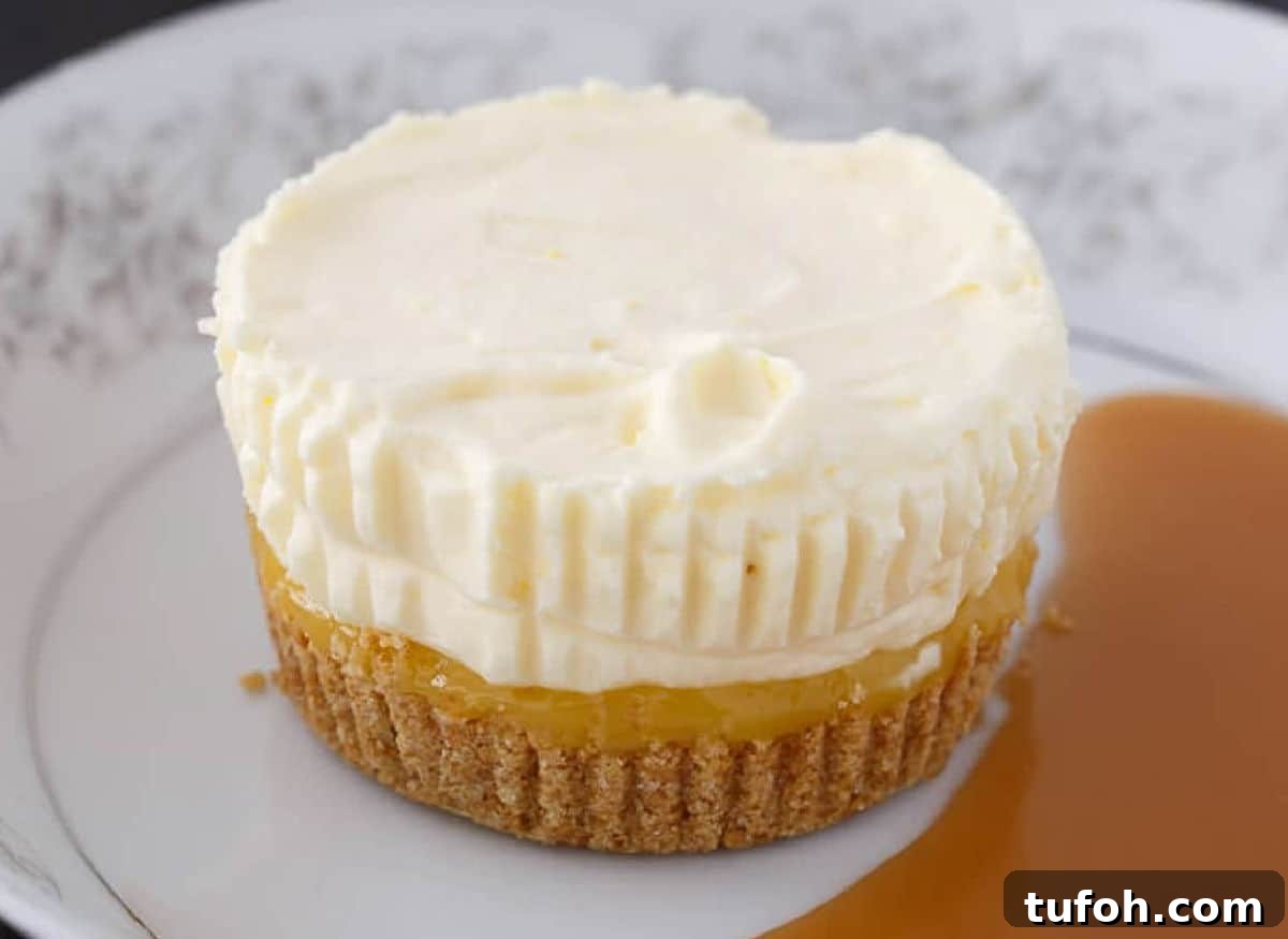 21 Kid-Friendly Treats to Make Together (Simple Recipes) 5 Pineapple Ice Cream Cake on a white plate next to a pool of sauce.