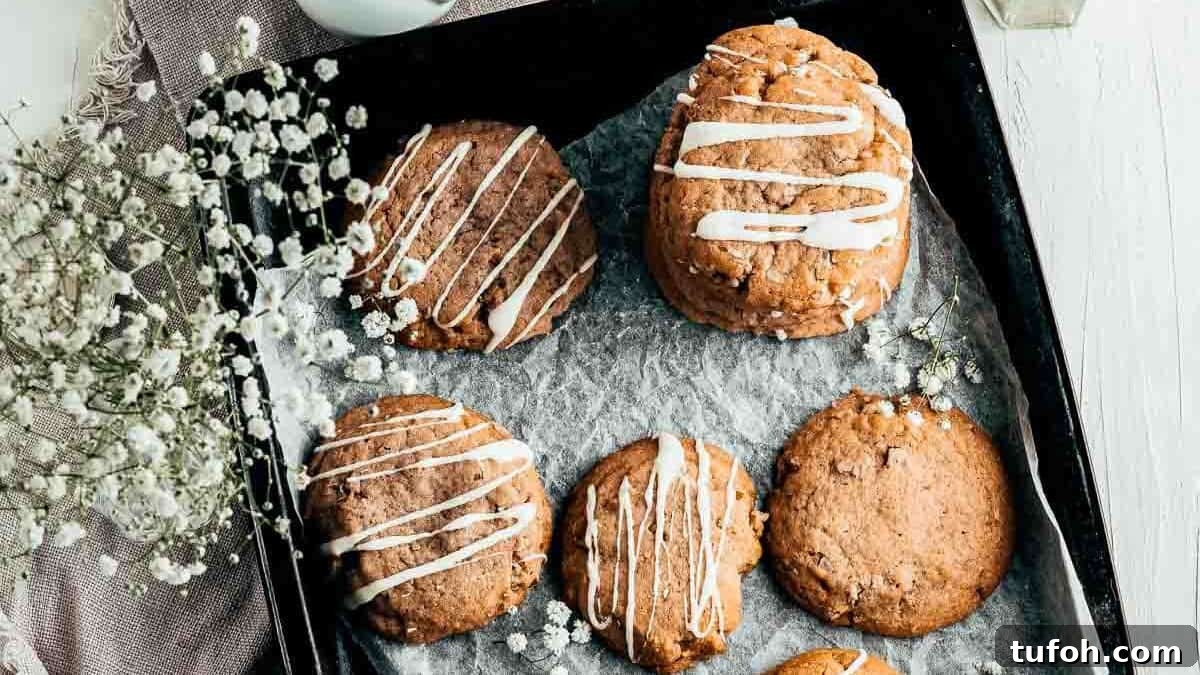 21 Kid-Friendly Treats to Make Together (Simple Recipes) 7 Butter pecan cookies on a tray drizzled with white chocolate.
