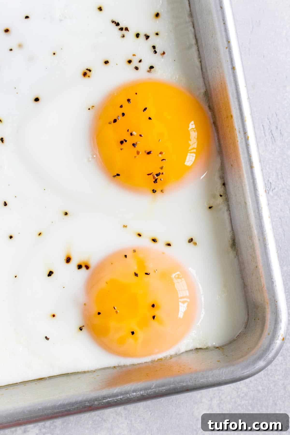 Close up of two egg yolks.