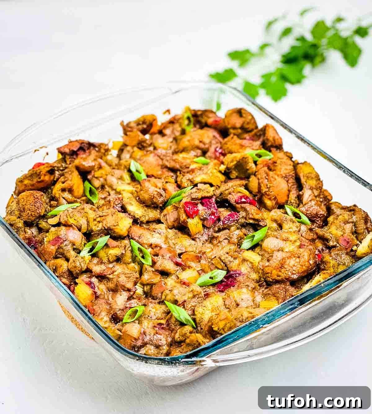 Savory Bacon and Cranberry Stuffing Recipe for Holidays 8 A closeup of the homemade stuffing in a baking dish.