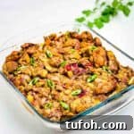 Savory Bacon and Cranberry Stuffing Recipe for Holidays 14 A closeup of the bacon and cranberry stuffing in a baking dish.
