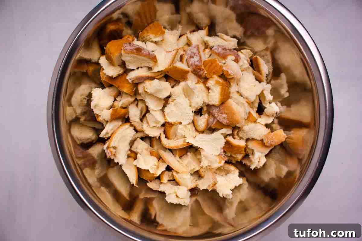 Savory Bacon and Cranberry Stuffing Recipe for Holidays 6 Bread cubes in a large bowl.