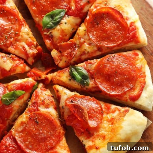 Square image of sliced pizza with cheese and pepperoni on a wooden board.