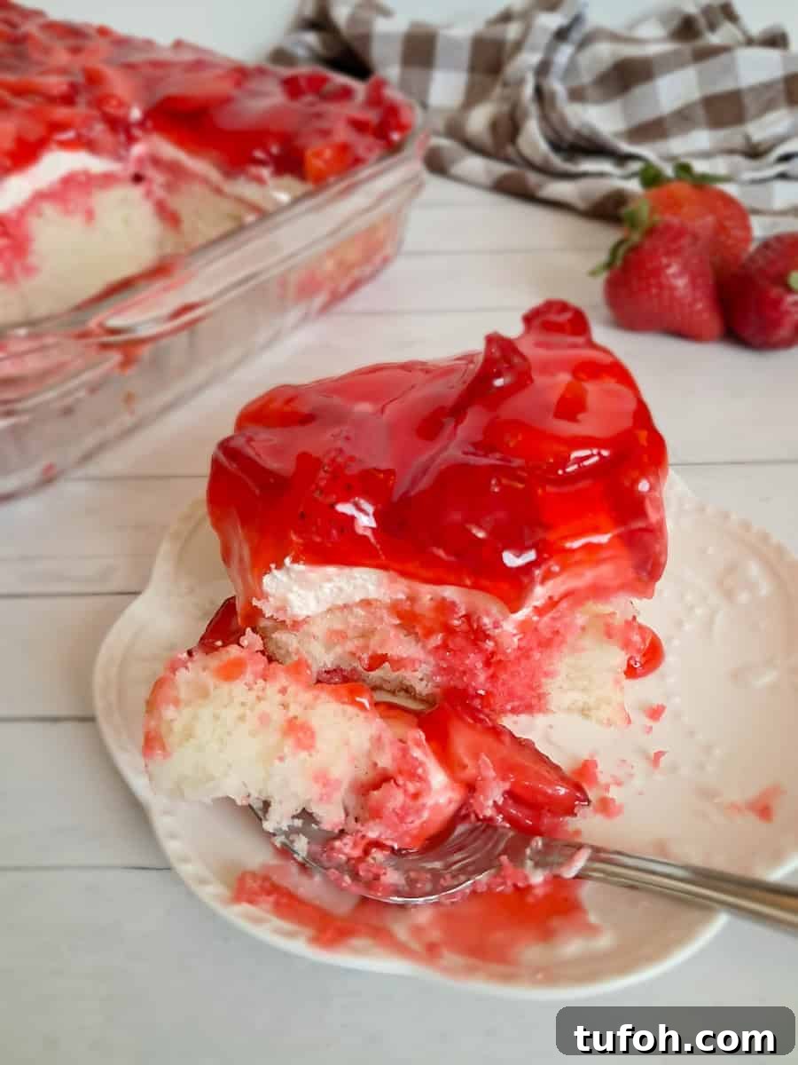 Amish Fruit Jello Cake Recipe: Classic Layered Dessert Guide 11 a slice of jello poke cake on a plate and we've been digging in.