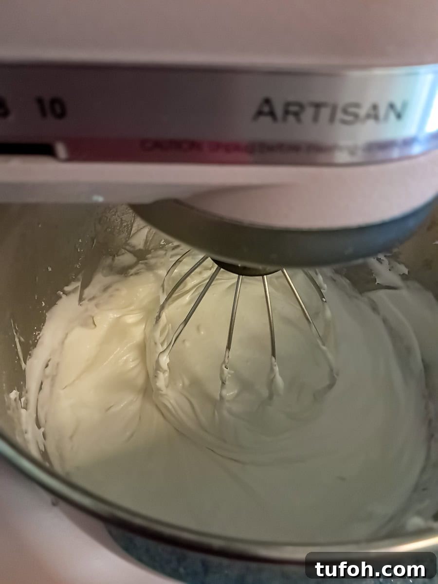 Amish Fruit Jello Cake Recipe: Classic Layered Dessert Guide 6 mixing the cream cheese filling in a large mixing bowl.