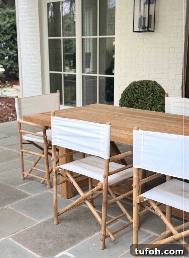 10 Clear Signs Spring Has Arrived and What They Mean 6 White canvas director chairs around teak table on bluestone patio