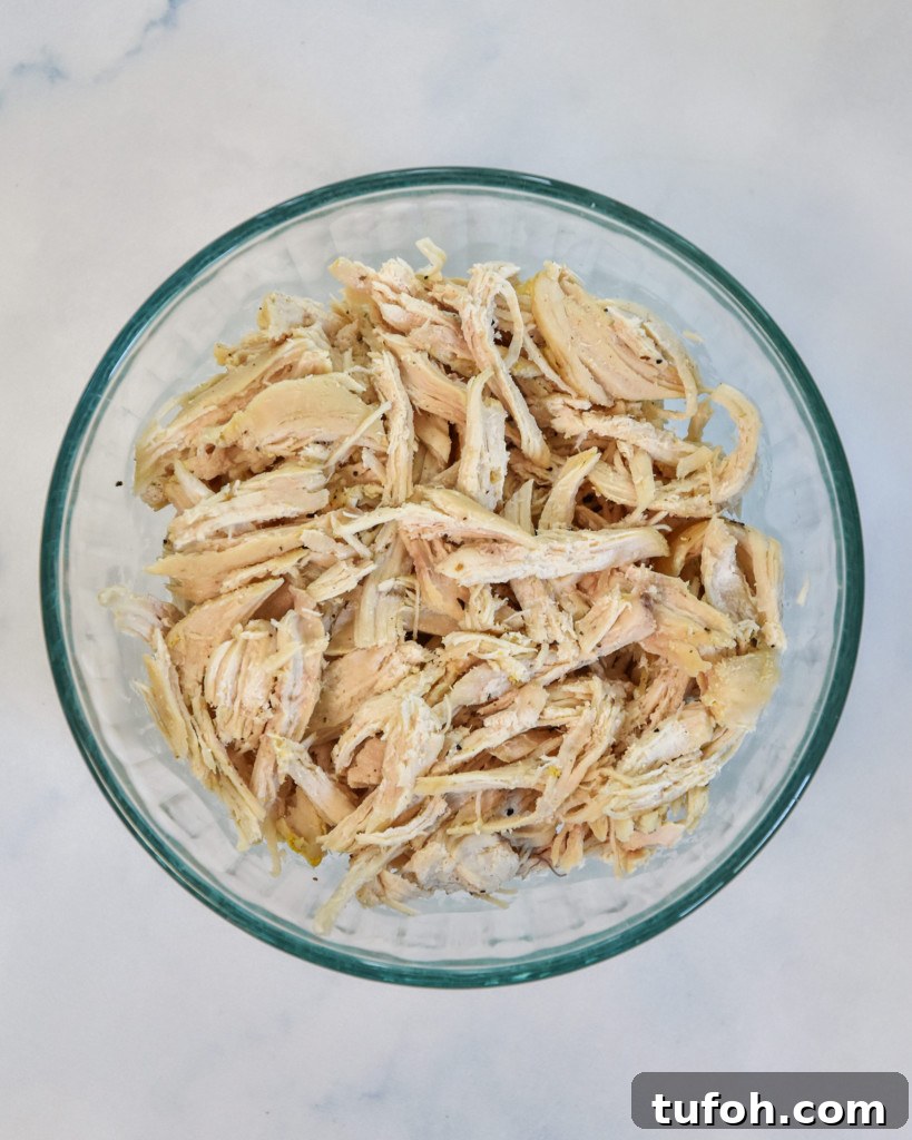 a bowl of shredded chicken for meal prep.