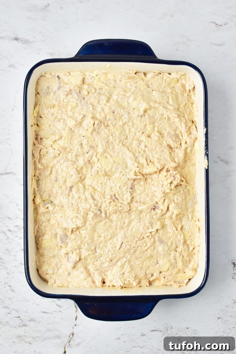 mixture added to a casserole dish ready for oven