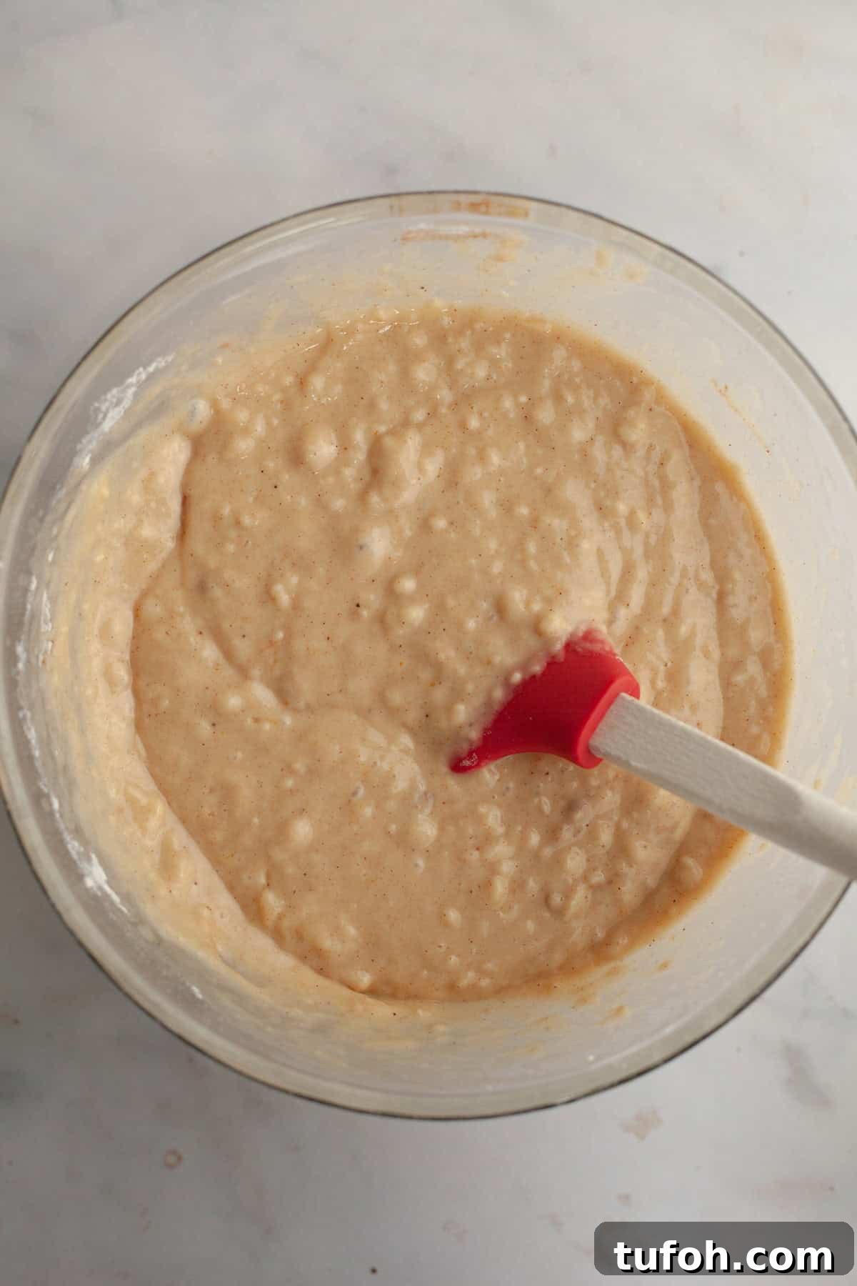 Cinnamon Mini Muffins Recipe: Quick, Soft & Flavorful 5 Cinnamon muffin batter in a glass bowl.